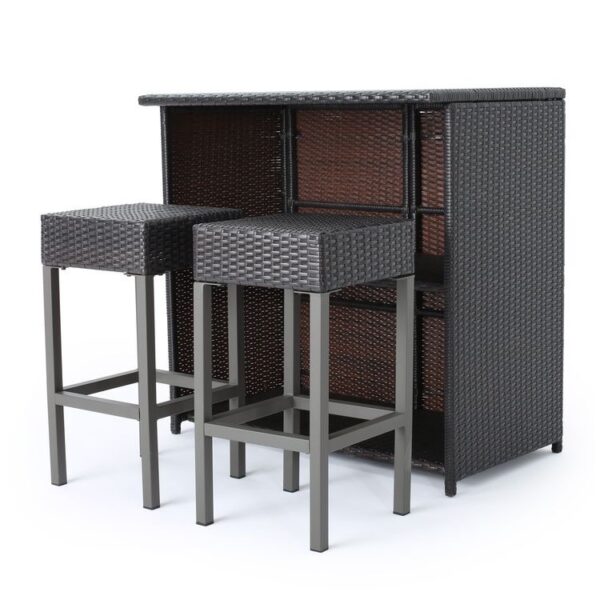 Outdoor rattan bar table with matching bar stools on a patio, featuring dark woven wicker design by Outadore Space