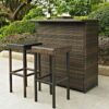 Outdoor rattan bar table with matching bar stools on a patio, featuring dark woven wicker design by Outadore Space