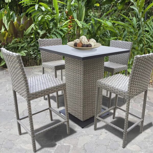 Outdoor wicker bar dining set with high chairs and square table in a garden patio setting by Outadore Space