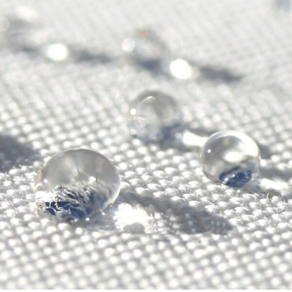 Waterproof outdoor fabric with water droplets showcasing moisture-resistant material used in Outadore Space furniture